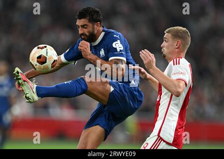 AMSTERDAM - Samuel Gigot of Olympique Marseille, Kenneth Taylor of Ajax during the UEFA Europa League match between Ajax Amsterdam and Olympique de Marseille at the Johan Cruijff ArenA on September 21, 2023 in Amsterdam, Netherlands. ANP OLAF KRAAK Stock Photo