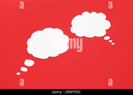 Blank speech bubbles on red background Stock Photo