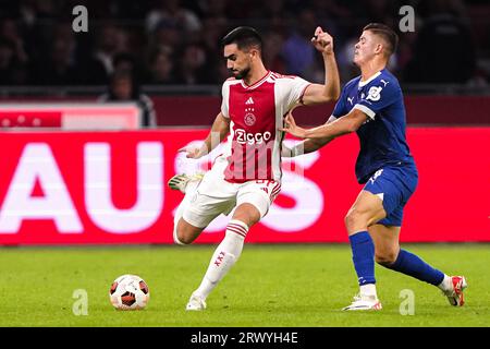 Amsterdam, Netherlands. 21st Sep, 2023. AMSTERDAM, NETHERLANDS - SEPTEMBER 21: Josip Sutalo of AFC Ajax battles for possession with Samuel Gigot of Olympique de Marseille during the UEFA Champions League Group B match between AFC Ajax and Olympique de Marseille at Johan Cruijff ArenA on September 21, 2023 in Amsterdam, Netherlands. (Photo by Andre Weening/Orange Pictures) Credit: Orange Pics BV/Alamy Live News Stock Photo