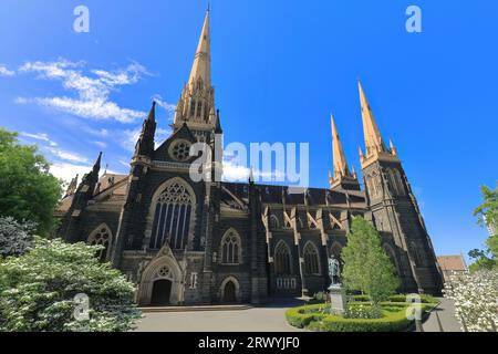 956 North side facade, forecourt, doorway, central spire and flanking towers of the St.Patrick's Cathedral. Melbourne-Australia. Stock Photo