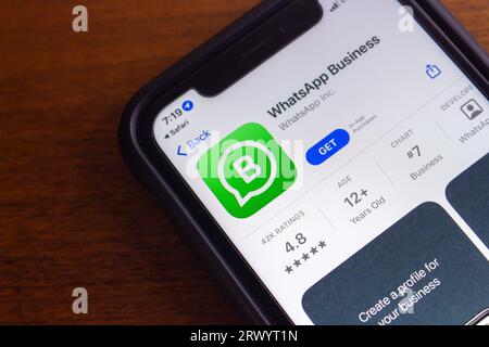 WhatsApp Business App seen in App Store. WhatsApp Business is an app designed for business owners who want to communicate with customers by WhatsApp Stock Photo