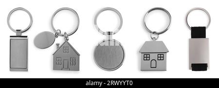 Set of metal key chains in different shapes isolated on white Stock Photo