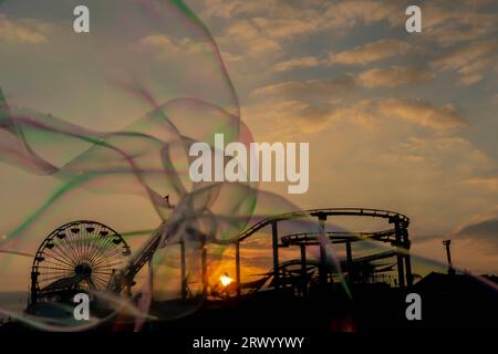 Santa Monica, CA, USA. 28th Sep, 2021. Sunset view of a pier on the California coast with liquid bubbles in the foreground (Credit Image: © Walter G Arce Sr Grindstone Medi/ASP) EDITORIAL USAGE ONLY! Not for Commercial USAGE! Stock Photo