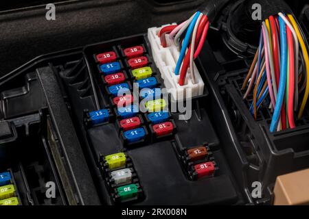 Fuse panel under the hood of vehicle. Automobile electrical repair, service and maintenance concept Stock Photo