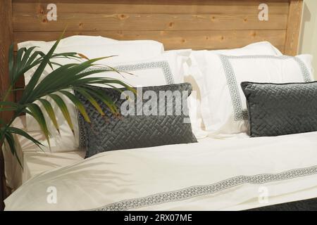 white pillow lined up on bed  Stock Photo