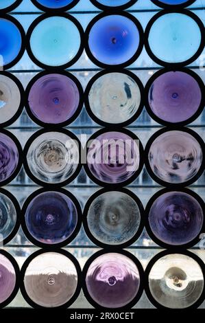 Close up photo of beautiful blue and purple circular glass window in Venice, Italy. Stock Photo