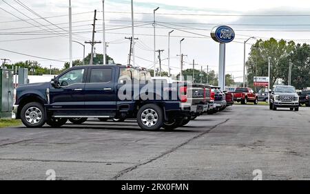 EMPORIA, KANSAS - SEPTEMBER, 21, 2023  Brand new Ford SuperDuty pickup trucks and Ford Broncos are delivered to the John North Ford dealership today. These are some of the last trucks built before the UAW went on strike last week. Stock Photo