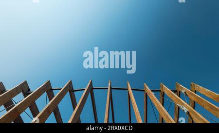 Wooden frames against a clear blue sky background Stock Photo