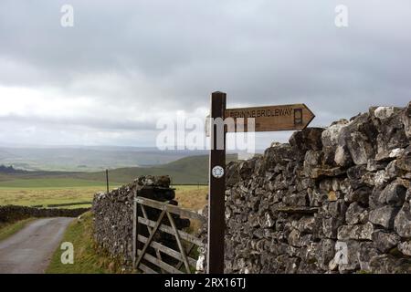 Wooden Signpost for Pennine Bridleway to Malham on Stockdale Lane near Settle in the Yorkshire Dales National Park, England, UK. Stock Photo