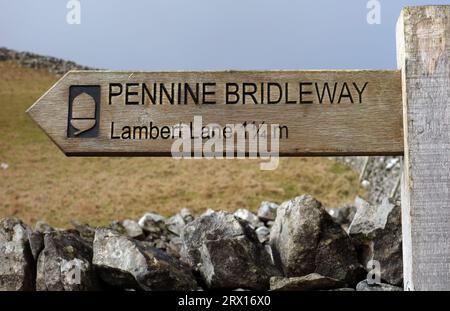 Wooden Signpost for Pennine Bridleway to Lambert Lane on Stockdale Lane near Settle in the Yorkshire Dales National Park, England, UK. Stock Photo