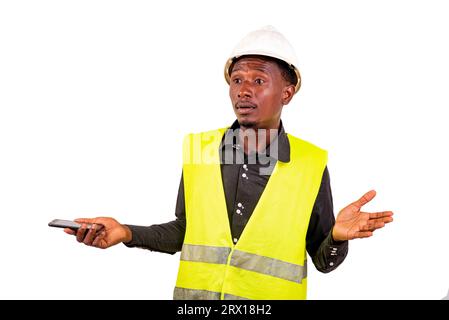construction engineer with safety helmet standing on white background with cellphone talking with hand gesture. Stock Photo