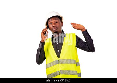 portrait of a construction engineer talking on the cell phone. Stock Photo