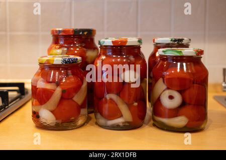 Canned tomatoes in glass jars Stock Photo