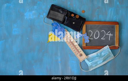 Problems in the New year 2024, finacial crisis,corona pandemic,climate change, American presidential election and ukraine war,flat lay, free copy spac Stock Photo