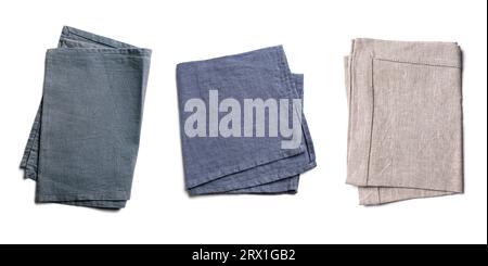 Linen textile napkin set isolated on white background. Beige, grey, blue cotton napkins. Stock Photo