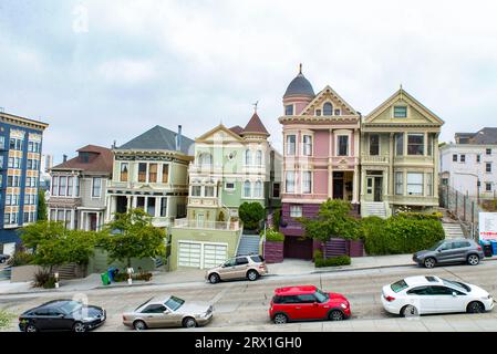 USA San Francisco The Painted Ladys on Alamo Square Postcard Row with pastel colored victorian houses Stock Photo