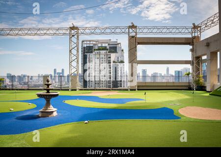 A golf putting course on the roof of The Baiyoke Sky Hotel in the Ratchathewi area of Bangkok, Thailand. Stock Photo