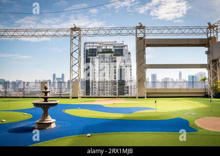 A golf putting course on the roof of The Baiyoke Sky Hotel in the Ratchathewi area of Bangkok, Thailand. Stock Photo