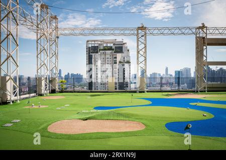 A golf putting course on the roof of The Baiyoke Sky Hotel in the Ratchathewi area of Bangkok, Thailand. Stock Photo