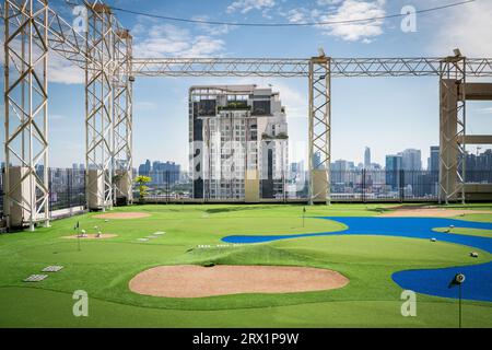 A golf putting course on the roof of The Baiyoke Sky Hotel in the Ratchathewi area of Bangkok, Thailand. Stock Photo