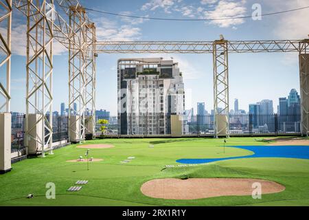 A golf putting course on the roof of The Baiyoke Sky Hotel in the Ratchathewi area of Bangkok, Thailand. Stock Photo