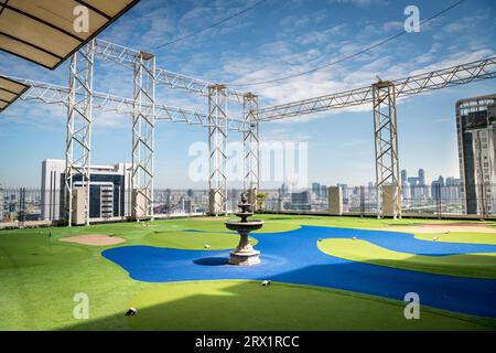 A golf putting course on the roof of The Baiyoke Sky Hotel in the Ratchathewi area of Bangkok, Thailand. Stock Photo