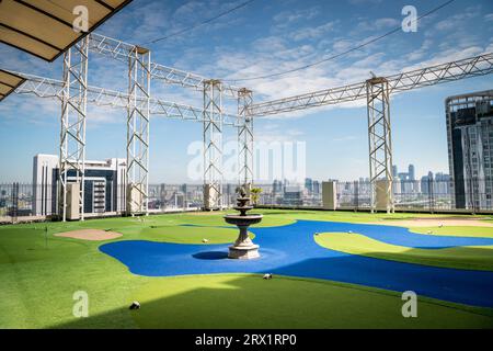 A golf putting course on the roof of The Baiyoke Sky Hotel in the Ratchathewi area of Bangkok, Thailand. Stock Photo