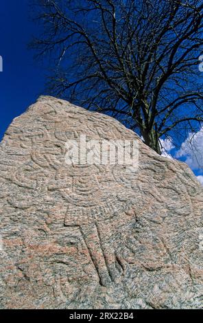 The GREAT RUNESTONE OF JELLING with the relief of Christ (Runestones of Jelling), HARALDS RUNESTONE with the figure of Christ (Jelling Stones) Stock Photo