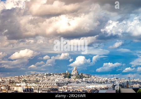 A view over Paris rooftops looking north from the Pompidou Centre towards The Basilica of Sacré-Cœur de Montmartre (The Basilica of the Sacred Heart) Stock Photo