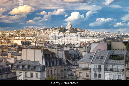 A view over Paris rooftops looking north from the Pompidou Centre towards The Basilica of Sacré-Cœur de Montmartre (The Basilica of the Sacred Heart) Stock Photo
