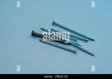 A colorful mix of nails and screws with eyelets and hoes Stock Photo
