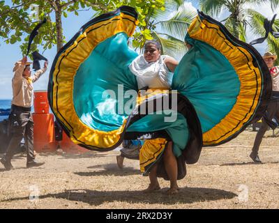 A group of young Costa Rican dancers in traditional dress perform at Playa Blanca, El Golfito, Costa Rica, Central America Stock Photo