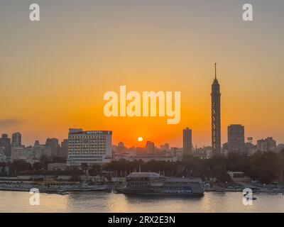 Sunset over the Cairo Tower from the east side of the Nile River, Cairo, Egypt, North Africa, Africa Stock Photo