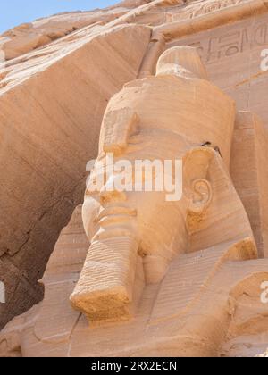 Detail of The Great Temple of Abu Simbel with its iconic 20 meter tall seated colossal statues of Ramses II (Ramses The Great), Abu Simbel, Egypt Stock Photo