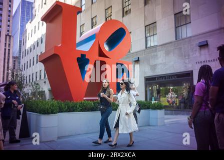 The public art sculpture 'Love' by Robert Indiana (1928-2018) is seen on display in Rockefeller Center in New York on Wednesday, September 20, 2023. The iconic 12 foot high sculpture at the entrance to the Channel Gardens as well as “ONE through ZERO (The Ten Numbers)” (1980-2001) and 193 flags with images from Indiana’s Peace Paintings will be on display until October 23, 2023.(© Richard B. Levine) Stock Photo