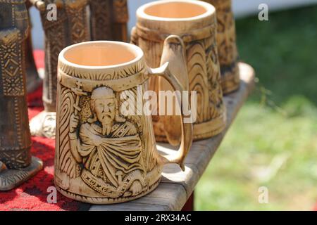 Wooden cup, wood carving, design on wooden cup, wooden beer cup, wooden coffee cup Stock Photo