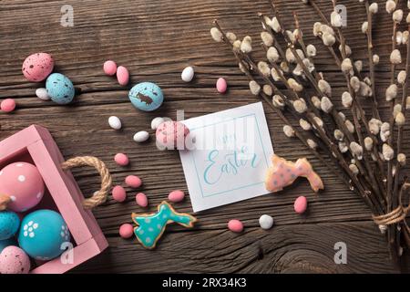 Easter gingerbread cookies on wooden table. Rabbits and eggs. Greeting card. Top view with space for your greetings Stock Photo