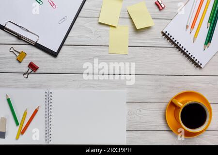 Desk White Yellow Cup Coffee Notepad Pencils Stickers Eraser Keyboard Mouse Binder Flower Paperclips Spring Flower Tablet Cleaner Field Stock Photo
