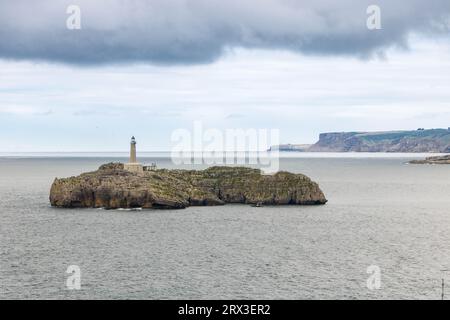 Mouro Island (Spanish: Isla de Mouro), a small uninhabited island in the Bay of Biscay, located off the Magdalena Peninsula at Santander, Spain Stock Photo