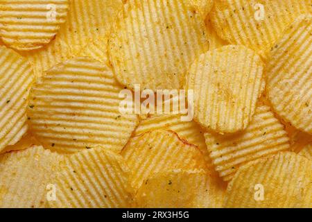 Lots of potato chips, texture close up Stock Photo