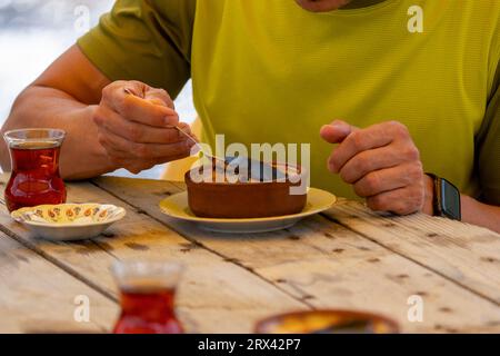 Turkish tea and rice pudding on the wood table Stock Photo