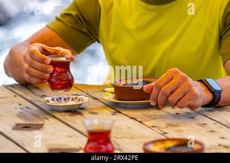 Turkish tea and rice pudding on the wood table Stock Photo