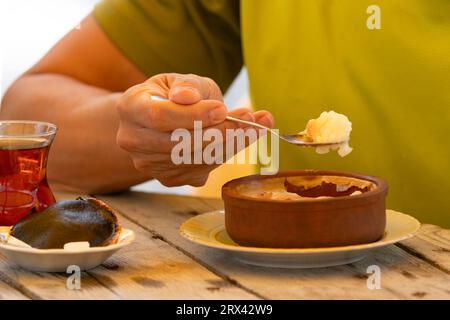 Turkish tea and rice pudding on the wood table Stock Photo