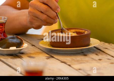 Turkish tea and rice pudding on the wood table Stock Photo