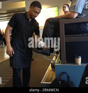 Seattle /Washington/USA- 27 June 2016-  May be amrica is only place where afro-american are still show shiner ,shoeshiner at Seattle aiport (setcom) seattle, washington              Photo. Francis Joseph Dean / Deanpictures. Stock Photo