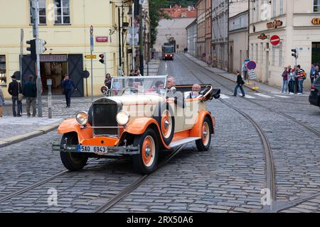 Prague, Czech Republic - August 18, 2010: A retro car Praga with tourists Stock Photo