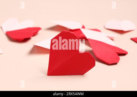 Beautiful hearts made of paper on pink background. National Sweetest Day Stock Photo