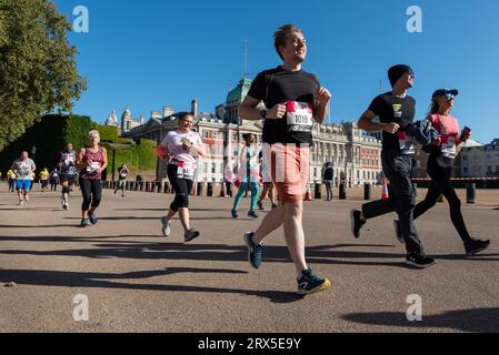 Horse Guards Road, Westminster, London, UK. 23rd Sep, 2023. Runners have taken to a one-mile course around St. James’s Park, starting in The Mall and finishing in front of Buckingham Palace. Thousands of runners of all ages and abilities set off in waves, with some looking to finish in a fast time while others walk. In its tenth year, the run is an Olympic legacy event Stock Photo