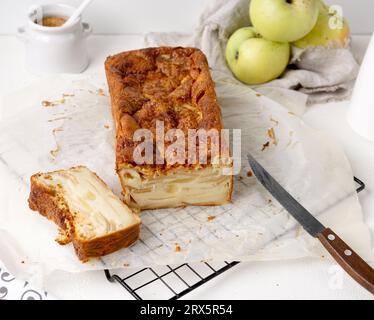 Apple Pie, tarta de Monzana, cutted piece on white table Stock Photo