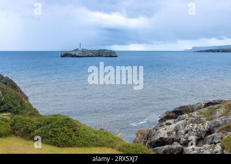 Mouro Island (Spanish: Isla de Mouro), a small uninhabited island in the Bay of Biscay, located off the Magdalena Peninsula at Santander in  Spain Stock Photo